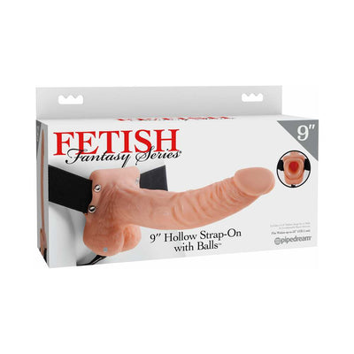 Packaging of Fetish Fantasy Series 9-inch hollow strap-on with balls and adjustable black elastic harness.
