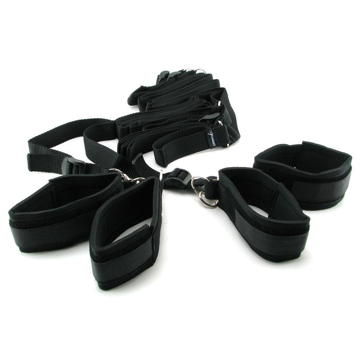 Black nylon bed restraint kit with adjustable padded cuffs for arms and legs, designed for secure and comfortable use.