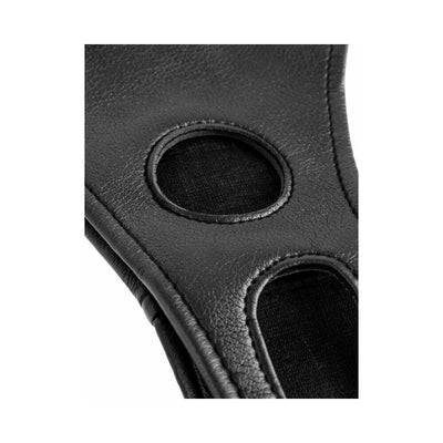 Close-up of black soft vinyl crotchless harness with circular openings and stitched edges.
