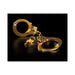 Pair of shiny gold metal handcuffs with three small keys on a black surface