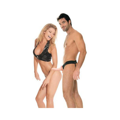 Couple modeling a hollow strap-on with adjustable black harness, showcasing the product's fit and use.