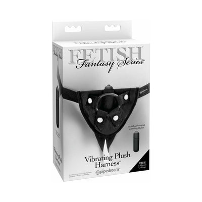 Packaging of Fetish Fantasy Series Vibrating Plush Harness by Pipedream showing the black plush strap-on harness with included vibrating bullet and silicone O-rings.