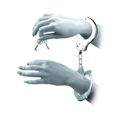 Hands secured in metal handcuffs with keys held above, showcasing the bondage accessory.