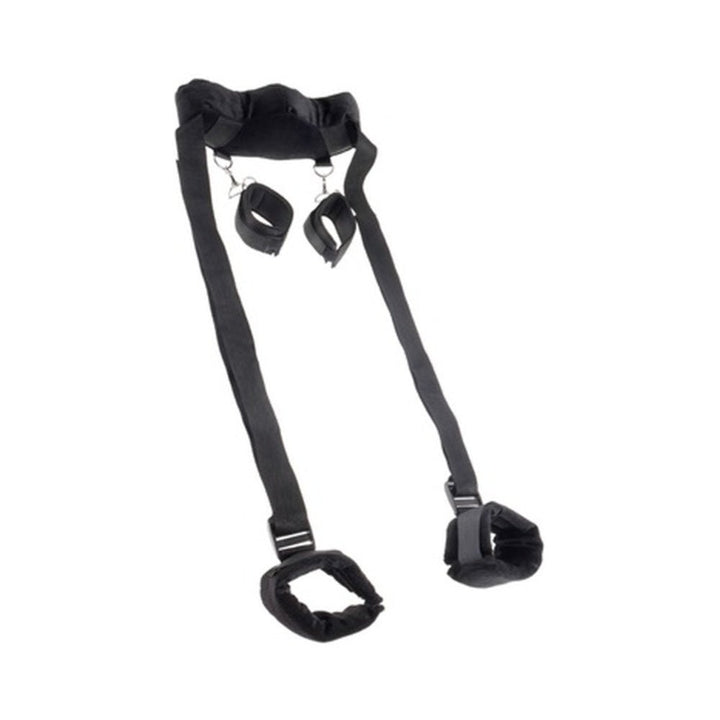 Black adjustable position master harness with padded cuffs for wrists and ankles on white background.