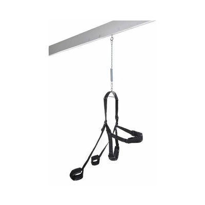 Black adjustable sex swing with padded supports and stirrups hanging from a metal beam with chain and spring suspension.