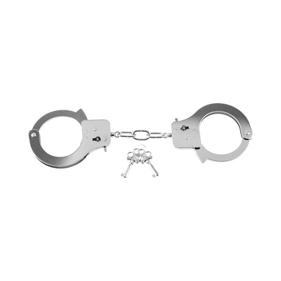 Silver metal handcuffs with three small keys on a white background
