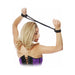 Woman wearing purple corset with black silk rope love cuffs securing her wrists behind her back