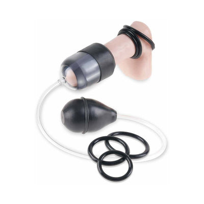 Black suction head pump with medical-style squeeze bulb, clear vacuum tube, and three black silicone rings on a flesh-colored model.