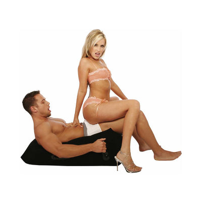 Couple demonstrating the Ultra Inflatable Position Master wedge pillow with handles for support and comfort.