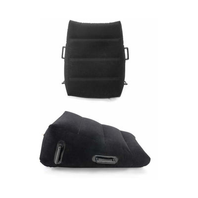 Black inflatable wedge pillow with textured surface and sturdy grip handles on the sides for support and stability.
