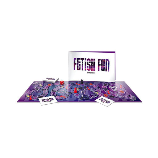 Fetish Fun board game set with game guide, trivia cards, dice, and player pieces on a purple-themed board.