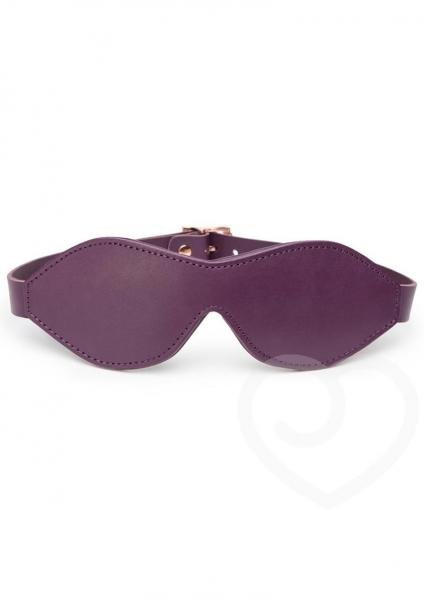 Dark purple leather blindfold with rose-gold buckle and adjustable strap for comfortable sensory deprivation play.