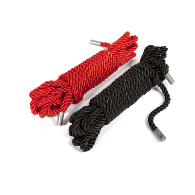 Twin pack of silky bondage ropes in red and black with metal capped ends, coiled neatly on a white background.