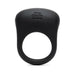 Black silicone vibrating love ring with textured top and Fifty Shades of Grey logo embossed on front.