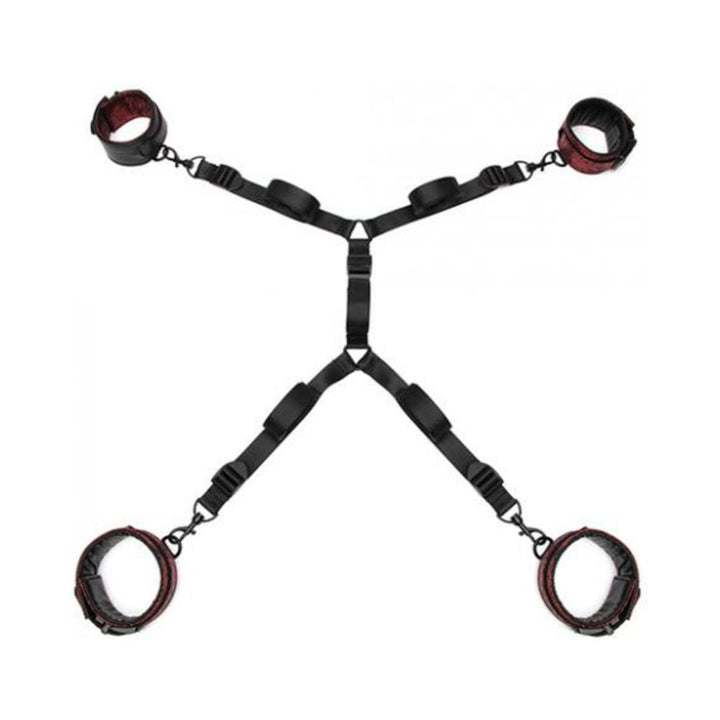 Under mattress restraint set with adjustable black straps and padded red and black cuffs for wrists and ankles.