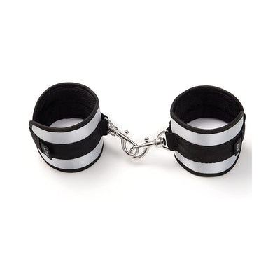 Pair of black and silver velvet-lined bondage handcuffs with metal clips for secure restraint play.