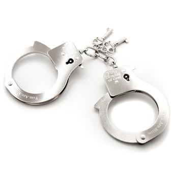 Silver metal handcuffs engraved with Fifty Shades of Grey logo and two keys attached by a small chain.