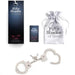 Fifty Shades of Grey You Are Mine metal handcuffs with keys, branded pouch, and packaging on white background.