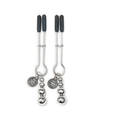 Pair of silver adjustable nipple clamps with black rubber tips and decorative beads, branded Fifty Shades of Grey charm.
