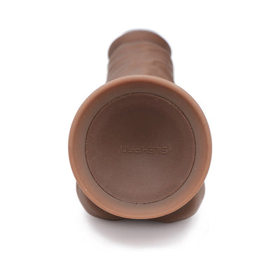 Brown flexible silicone vibrating dong with suction cup base, shown from the bottom on a white background.