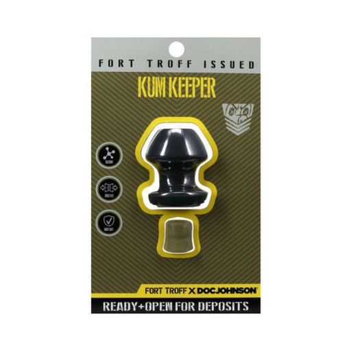 Small black silicone Kum Keeper plug by Fort Troff in retail packaging with yellow and black accents.