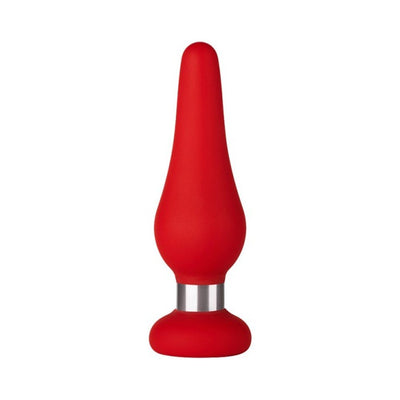 Compact red silicone pleasure device with a tapered tip and flat base featuring a silver accent ring.