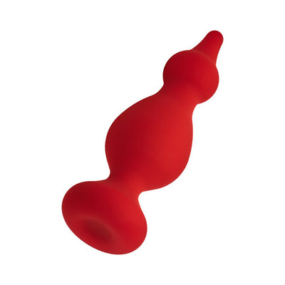 Red silicone cone with a tapered tip and flat base, designed for comfortable and flexible use.