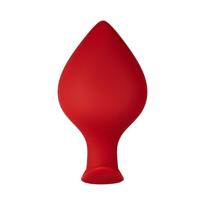 Large red silicone plug with a flared base and smooth, spade-shaped design.
