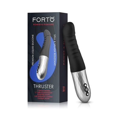Black and silver Forto Thruster personal massager with ergonomic design and control buttons, displayed with packaging box.