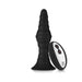 Black ribbed silicone plug with a flared base and a white and black remote control.