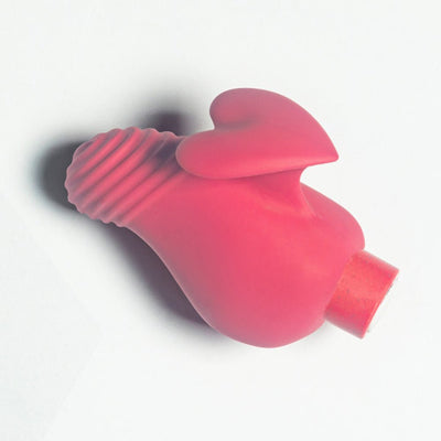 Coral pink eco-friendly vibrator with ribbed tip and heart-shaped fin for comfortable grip and targeted stimulation.