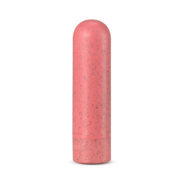 Coral-colored eco-friendly rechargeable bullet vibrator with a smooth, speckled plant-based bioplastic surface.