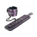 Purple faux leather wrist restraints with soft lining, adjustable buckles, and a detachable chain link with snap clip.