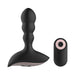 Black silicone anal vibrator with ergonomic base and matching remote control on white background.