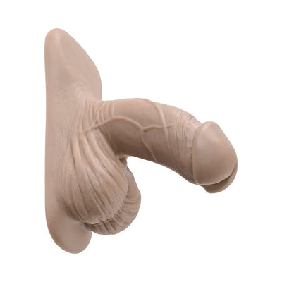 Realistic 4-inch silicone packer with detailed texture and lifelike appearance in natural skin tone.