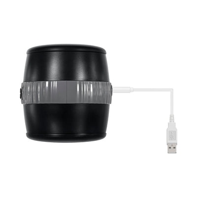 Black barrel-shaped stroker with gray center grip and attached white USB charging cable on white background.