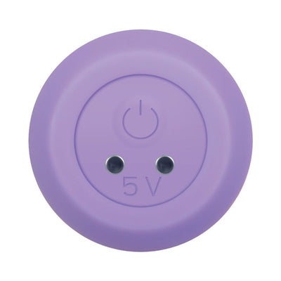 Close-up of purple silicone magnetic charging base with power button and 5V marking for Gender X vibrator.