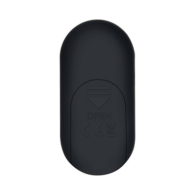 Black oval-shaped remote control for Gender X Our Undie Vibe with smooth matte finish and battery compartment marked open.
