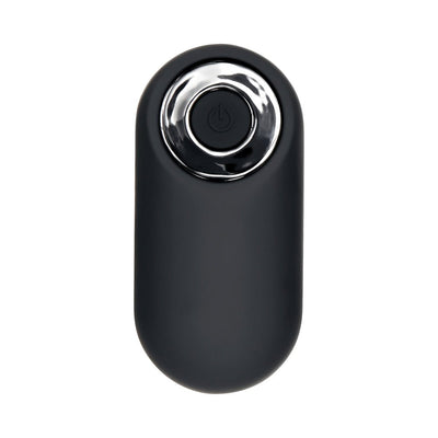 Black compact remote control with a single power button and silver accent ring for a rechargeable vibe.