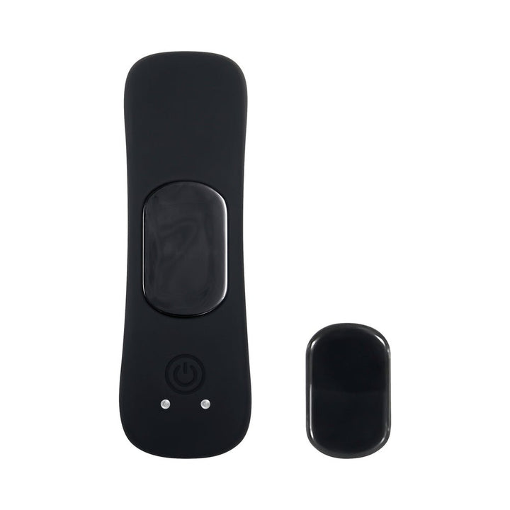 Black sleek remote control and compact magnetic rechargeable vibe for discreet pleasure with smooth silicone finish.