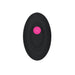 Black oval remote control with a central pink power button for Gender X Pink Paradise Rechargeable vibrator.
