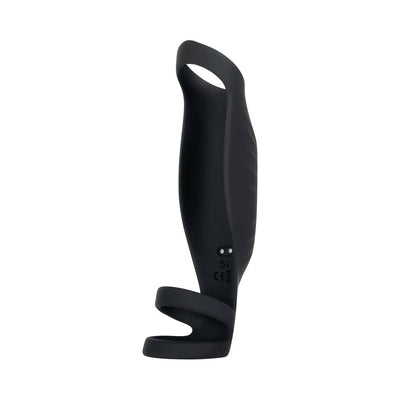 Black silicone vibrating penis sheath with triple ring design and textured surface, shown upright on white background.