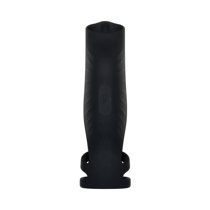 Black silicone vibrating penis sheath with triple ring design and central power button on a white background.