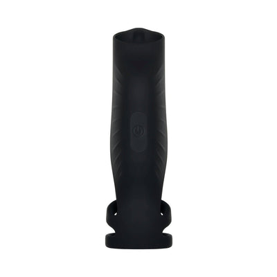 Black silicone vibrating penis sheath with triple ring design and central power button on a white background.