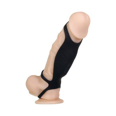 Black triple ring vibrating penis sheath displayed on a flesh-toned model with suction base on white background.