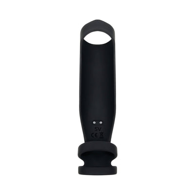Black silicone vibrating penis sheath with triple ring design and USB charging contacts visible on the back.
