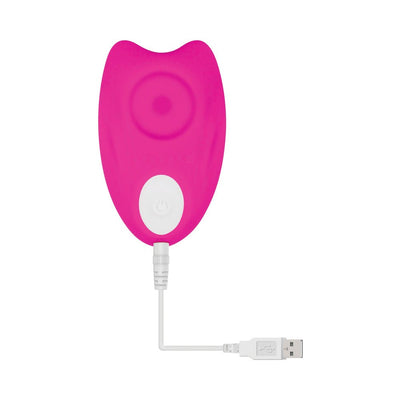Pink rechargeable silicone underwear vibrator with USB charging cable attached, shown on white background.