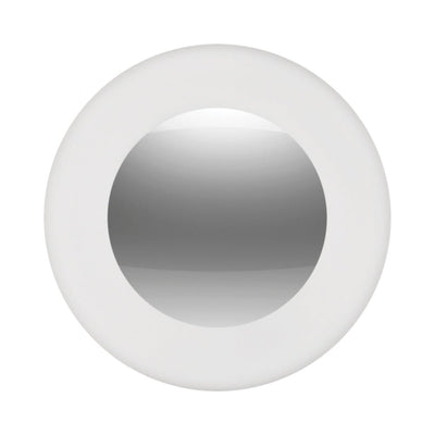 Round pink silicone wearable vibrator with smooth curved design and magnetic center for discreet attachment.