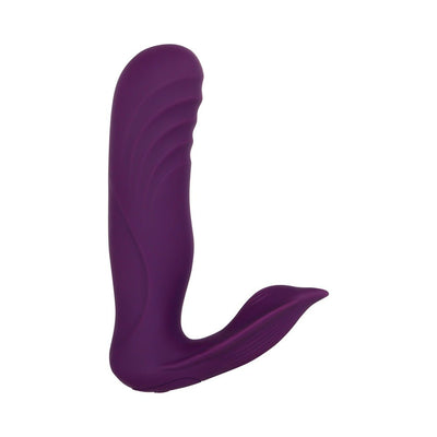 Purple dual-motor wearable massager with textured shaft and curved external stimulator in smooth silicone finish.