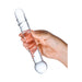 Hand holding a clear glass dildo with spiraled ridges and rounded nubs, designed for targeted internal stimulation.